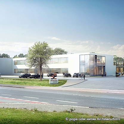 Moderne Architektur eines Gebäudes, umgeben von Bäumen und parkenden Autos. Die Frontfassade besteht größtenteils aus Glas, mit breitem Eingangsbereich. Menschen gehen entlang des Gehwegs in Richtung Eingang. Das Bild vermittelt einen klaren und einladenden Eindruck.