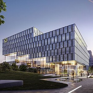 Moderne Bürogebäude mit glasierter Fassade und mehreren Etagen, umgeben von Grünflächen. Vor dem Gebäude sind Wasserspiele zu sehen. Die Architektur ist elegant und zeitgemäß, mit Sicht auf die Stadt im Hintergrund. Der Himmel zeigt einen sanften Übergang zum Abendlicht.